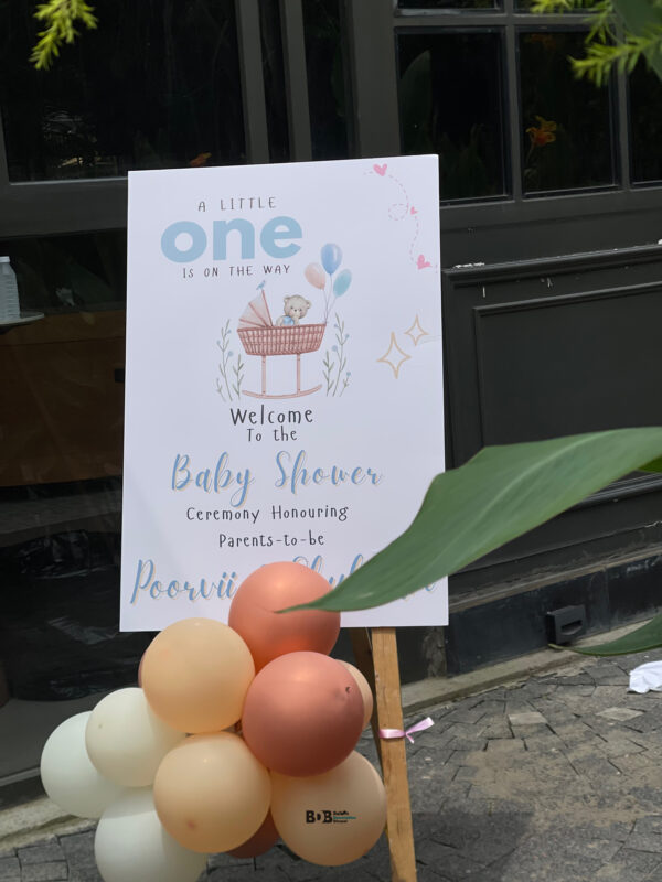 Pastel and rose gold baby shower balloon decoration with welcome board and teddy theme backdrop in Bhopal