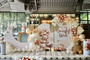 Pastel and rose gold baby shower balloon decoration with welcome board and teddy theme backdrop in Bhopal