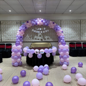 Lavender theme birthday balloon decoration with purple pastel balloon arch in Bhopal banquet hall