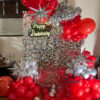 Red and silver anniversary balloon decoration with LED backdrop in Bhopal