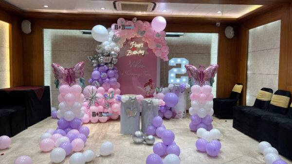 Butterfly theme pastel pink and lavender 2nd birthday balloon decoration for baby girl in Bhopal