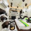 Black and silver birthday surprise room decoration with balloons and happy birthday backdrop in Bhopal
